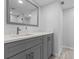 Bathroom with gray vanity, quartz countertop, and a mirror at 220 Belleview Blvd # 607, Belleair, FL 33756