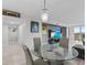 Modern dining area with glass table and gray chairs at 220 Belleview Blvd # 607, Belleair, FL 33756