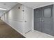 Condo hallway with carpet and neutral walls at 220 Belleview Blvd # 607, Belleair, FL 33756