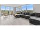 Spacious living room with large windows and comfortable seating at 220 Belleview Blvd # 607, Belleair, FL 33756