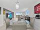 Living room with sectional sofa and large TV at 220 Belleview Blvd # 607, Belleair, FL 33756