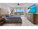 Main bedroom with large windows and a ceiling fan at 220 Belleview Blvd # 607, Belleair, FL 33756