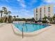 Refreshing community pool with ample lounge chairs at 220 Belleview Blvd # 607, Belleair, FL 33756