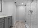 Clean shower with marble-like wall tiles and glass enclosure at 220 Belleview Blvd # 607, Belleair, FL 33756
