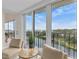 Stunning water views from the living room with sliding glass doors to balcony at 220 Belleview Blvd # 607, Belleair, FL 33756