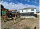 Large backyard with playground and home view at 24932 Ravello St, Land O Lakes, FL 34639