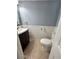 Clean bathroom with a white toilet and dark vanity at 24932 Ravello St, Land O Lakes, FL 34639