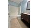 Updated bathroom with granite vanity and tile floor at 24932 Ravello St, Land O Lakes, FL 34639