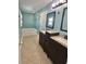 Bathroom with double vanity, soaking tub, and tile flooring at 24932 Ravello St, Land O Lakes, FL 34639