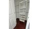Walk-in closet with shelving and hanging rod at 24932 Ravello St, Land O Lakes, FL 34639