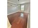 Spacious dining room featuring hardwood floors and a window with shutters at 24932 Ravello St, Land O Lakes, FL 34639