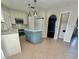 Spacious kitchen with an island, stainless steel appliances, and white cabinets at 24932 Ravello St, Land O Lakes, FL 34639