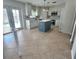 Modern kitchen featuring an island, stainless steel appliances, and white cabinets at 24932 Ravello St, Land O Lakes, FL 34639
