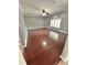 Large living room with hardwood floors and a ceiling fan at 24932 Ravello St, Land O Lakes, FL 34639