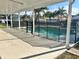 Inviting pool area with safety fence and covered patio at 24932 Ravello St, Land O Lakes, FL 34639