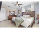 Bedroom featuring a wooden bed frame, wood-paneled wall, and neutral color palette at 271 49Th N St, St Petersburg, FL 33710