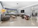 Open living area with brick accent wall and terrazzo floor at 271 49Th N St, St Petersburg, FL 33710