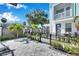 Small paved patio with black metal fence and grill at 2819 1St S Ave, St Petersburg, FL 33712