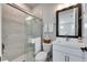 Clean and modern bathroom with a walk-in shower and white vanity at 2819 1St S Ave, St Petersburg, FL 33712