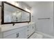 Modern bathroom with double vanity, large mirror, and walk-in shower at 2819 1St S Ave, St Petersburg, FL 33712