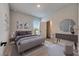Spacious bedroom with a dresser and large bed at 2819 1St S Ave, St Petersburg, FL 33712