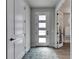 Bright and airy entryway with modern door and flooring at 2819 1St S Ave, St Petersburg, FL 33712