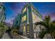 Modern three-story townhome with light teal exterior and private patio at 2819 1St S Ave, St Petersburg, FL 33712