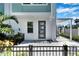 Private entrance with gray door and paved patio area at 2819 1St S Ave, St Petersburg, FL 33712
