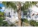 Landscaped front yard with palm tree and walkway at 2819 1St S Ave, St Petersburg, FL 33712