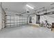 Attached garage with overhead storage and epoxy floor at 2819 1St S Ave, St Petersburg, FL 33712