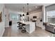 Open concept kitchen featuring a large island and white cabinets at 2819 1St S Ave, St Petersburg, FL 33712
