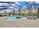 Relaxing pool and spa with screened enclosure and lounge chairs at 31627 Colada Drift Way, Wesley Chapel, FL 33545