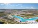 Aerial view of Crystal Lagoon and community at 31672 Cardinal Yard Dr, San Antonio, FL 33576