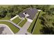 New construction home with a large yard and driveway at 3305 W Oak Ave, Plant City, FL 33563