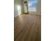 Bright bedroom with large window and hardwood floors at 3305 W Oak Ave, Plant City, FL 33563