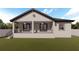 Home with a large back porch and fenced yard at 3305 W Oak Ave, Plant City, FL 33563