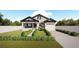 Craftsman style home with a front porch and landscaped yard at 3305 W Oak Ave, Plant City, FL 33563