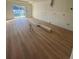 Bright living room with sliding glass doors and hardwood floors at 3305 W Oak Ave, Plant City, FL 33563