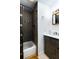 Clean bathroom with a tub, vanity, and dark tile at 331 25Th S St, St Petersburg, FL 33712