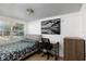 Cozy bedroom with a double bed, desk, and window at 331 25Th S St, St Petersburg, FL 33712