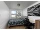 Small bedroom with a double bed, desk and window at 331 25Th S St, St Petersburg, FL 33712