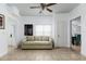 Light-filled living room with beige sofa and tile floors at 331 25Th S St, St Petersburg, FL 33712