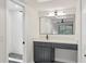 Bathroom with a vanity, mirror, and shower at 3426 Reynoldswood Dr, Tampa, FL 33618