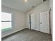 Bedroom with carpet flooring and a window at 36197 Trinity Glade Rd, Dade City, FL 33525