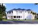Two-story house with a modern design, dark blue roof, and white walls at 4009 W Euclid Ave, Tampa, FL 33629
