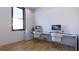 Modern home office with two desks and a large window at 4009 W Euclid Ave, Tampa, FL 33629