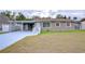 Tan house with carport and ramp access at 4113 Leonard St, Valrico, FL 33594