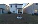 Large backyard with fire pit and view of neighboring houses at 4410 Summer Savory St, Tampa, FL 33619