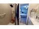 Clean bathroom with shower and view into bedroom at 4410 Summer Savory St, Tampa, FL 33619