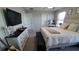 Spacious bedroom with a king-size bed, dresser, and large TV at 4410 Summer Savory St, Tampa, FL 33619